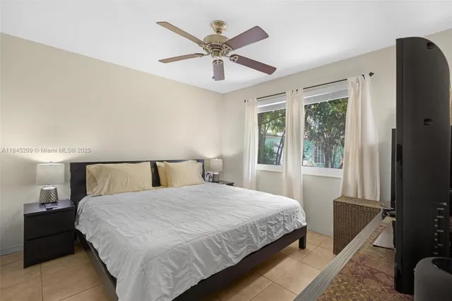 a spacious bathroom with a sink double vanity granite and a shower