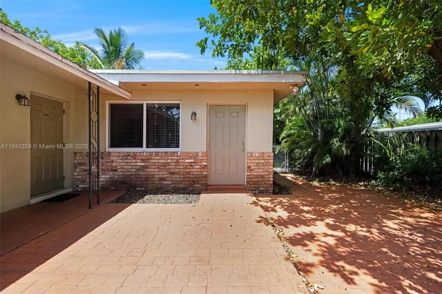 a house view with a backyard space