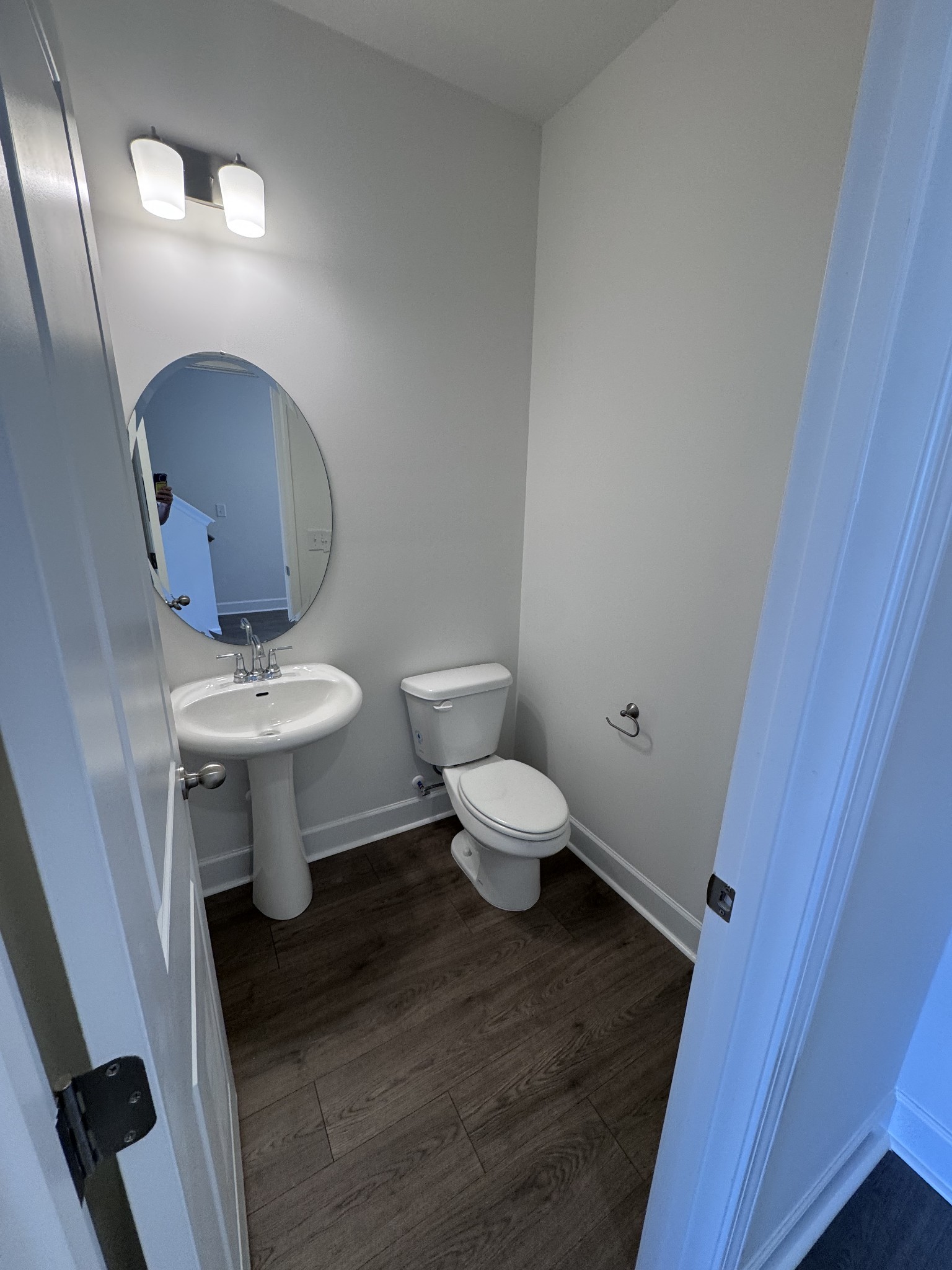 1095 June Wilde Ridge Spring Hill, TN 37174 - Photo 7 of 33 a bathroom with a toilet sink and mirror