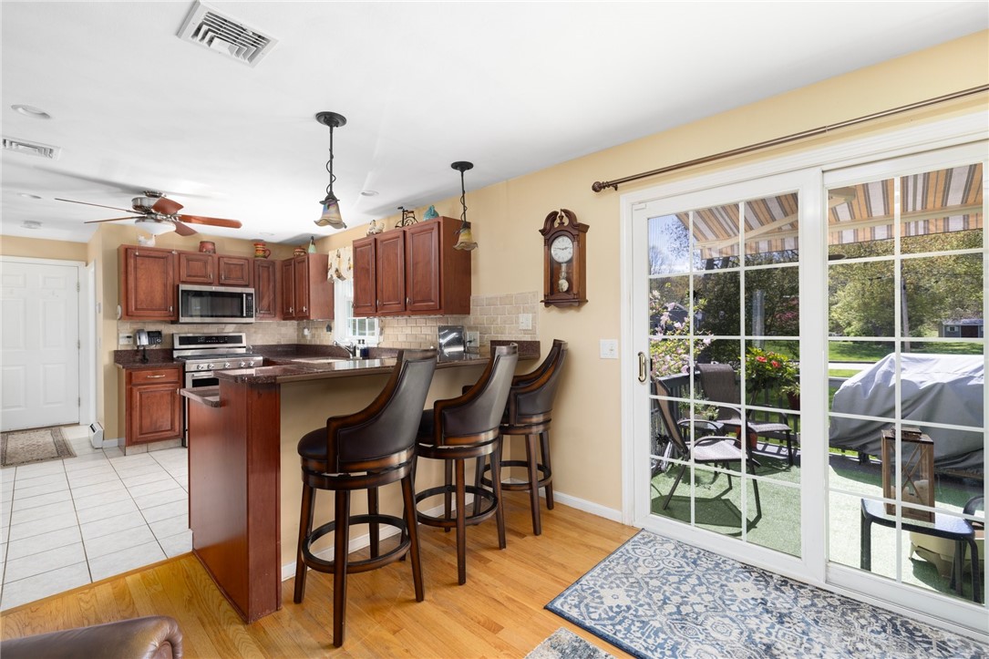 28 Whispering Pines Drive Cranston, RI 02921 - Photo 16 of 46 Breakfast Bar/Door to Deck