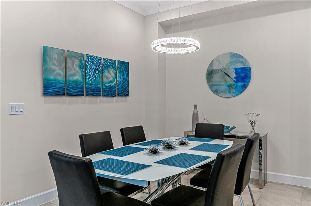 5827 Haiti Drive Naples, FL 34113 - Photo 12 of 29 a view of a dining room with furniture