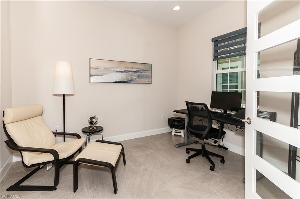 5827 Haiti Drive Naples, FL 34113 - Photo 17 of 29 a view of a workspace with furniture and a window