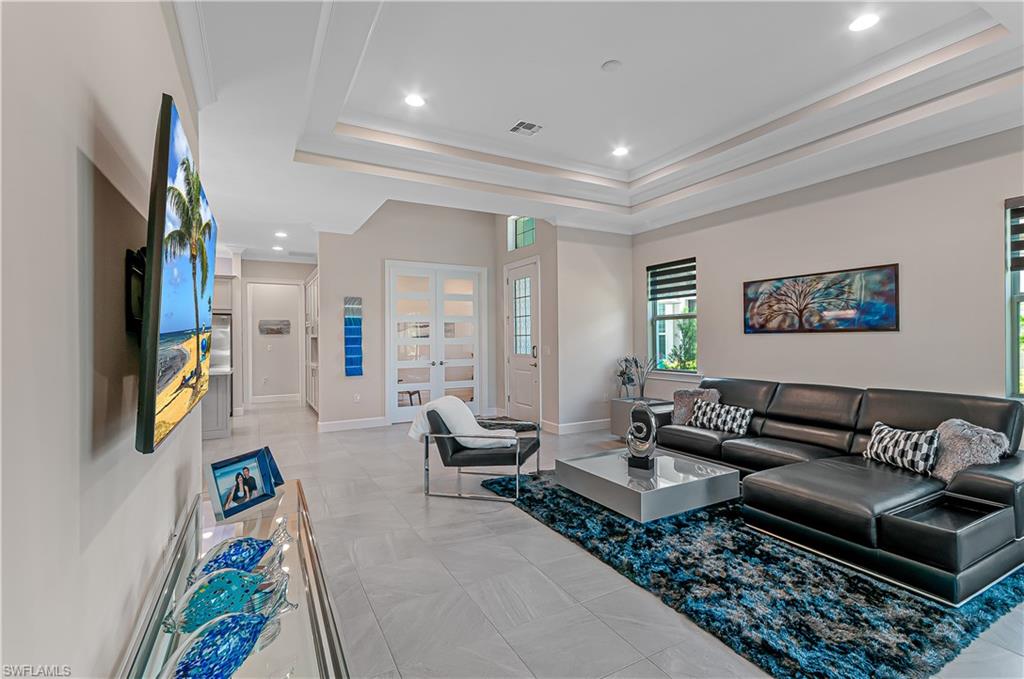 5827 Haiti Drive Naples, FL 34113 - Photo 20 of 29 a living room with furniture and a rug