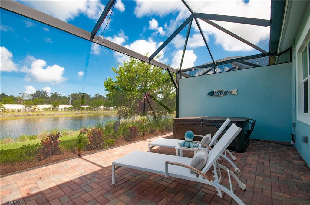 5827 Haiti Drive Naples, FL 34113 - Photo 23 of 29 a view of a patio with chair and table