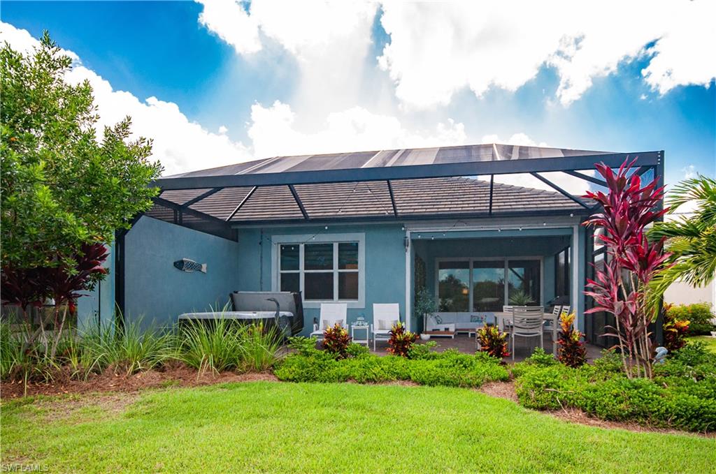 5827 Haiti Drive Naples, FL 34113 - Photo 26 of 29 a front view of a house with garden