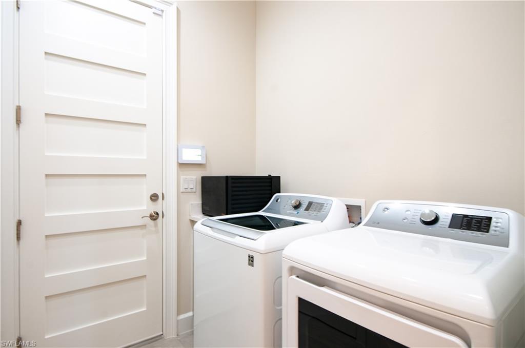 5827 Haiti Drive Naples, FL 34113 - Photo 29 of 29 a utility room with dryer and washer