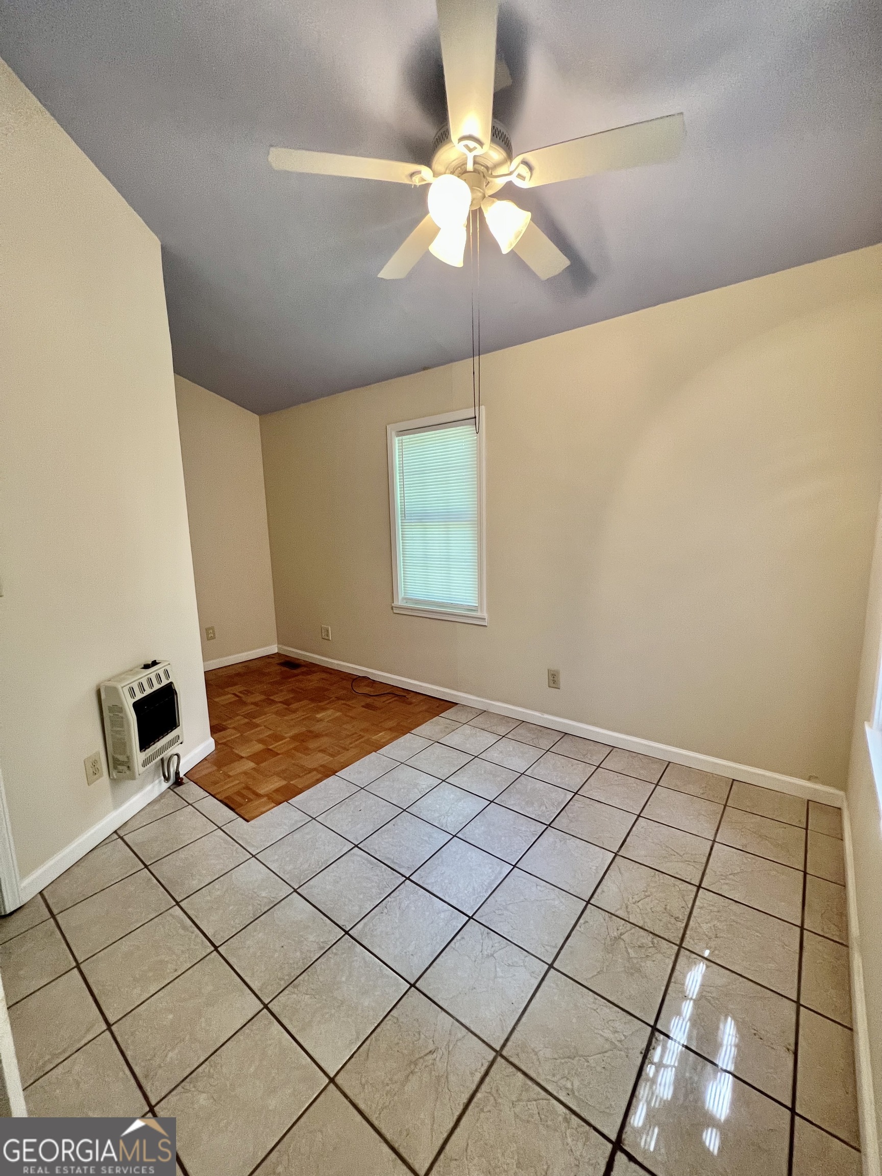 112 Cherry Lane Athens, GA 30601 - Photo 4 of 11 a bedroom with a bed and a chandelier