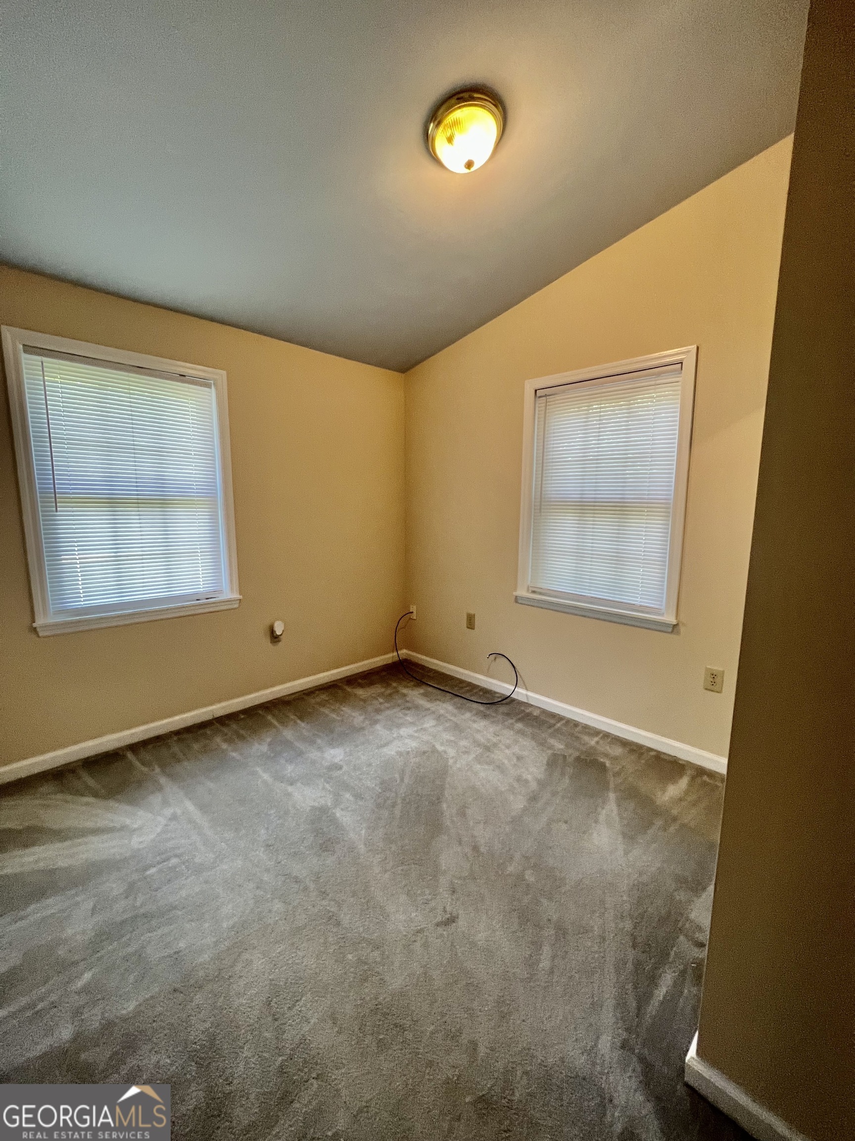 112 Cherry Lane Athens, GA 30601 - Photo 9 of 11 an empty room with a empty space and windows