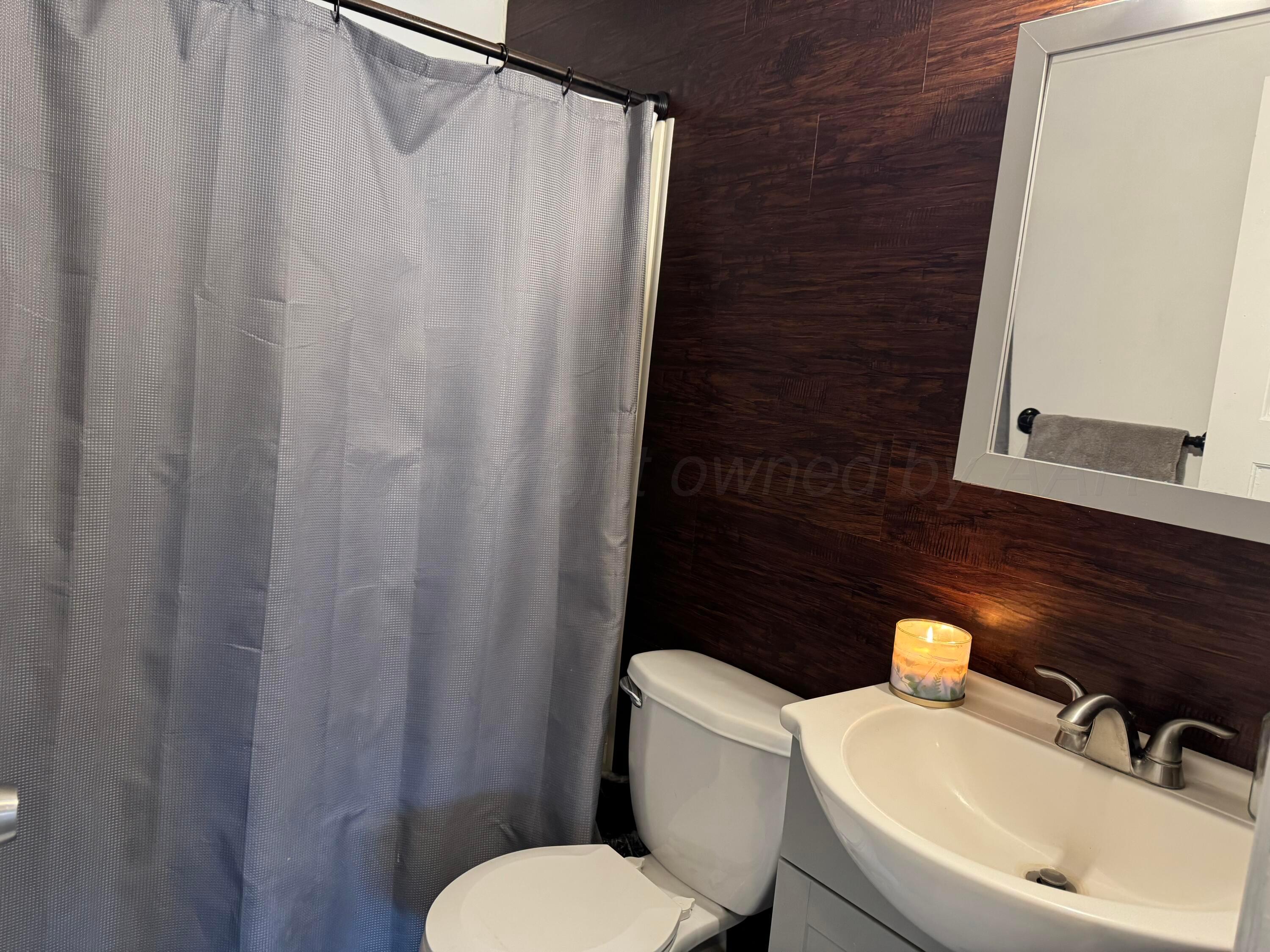 211 South 7th Street Canadian, TX 79014 - Photo 11 of 11 a white toilet sitting next to a bathroom sink