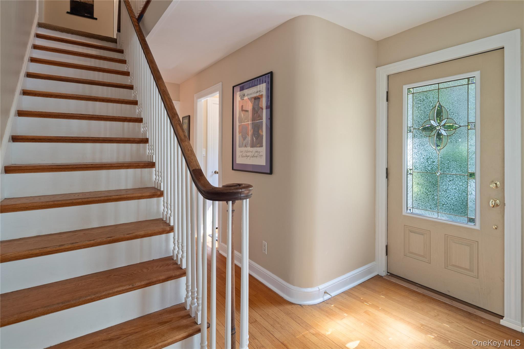 611 Decatur Avenue Peekskill, NY 10566 - Photo 29 of 50 The original staircase, with its curved wooden handrail, leads you to the second floor.