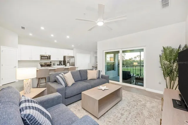 a living room with furniture and a window