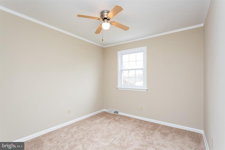 509 New Road Southampton, NJ 08088 - Photo 22 of 25 an empty room with a window and a fan