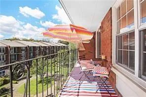 a view of balcony with furniture