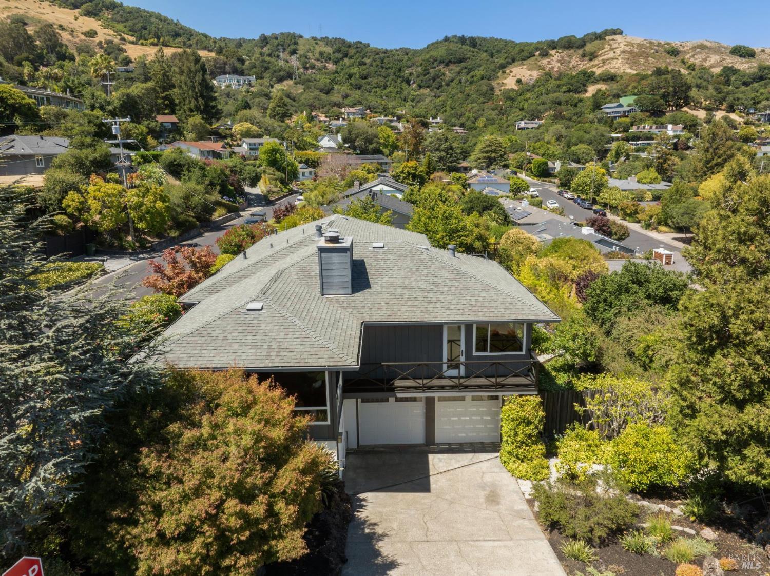 a aerial view of a house with a yard