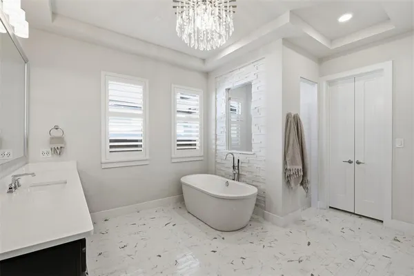 a spacious bathroom with a sink and a bathtub