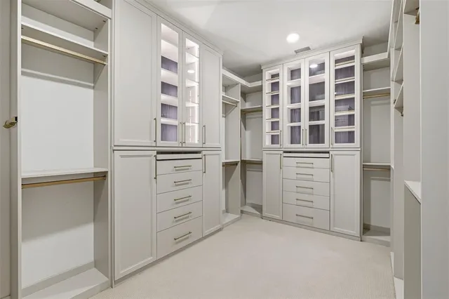 a view of walk in closet with windows
