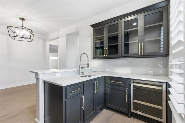 a kitchen with a sink and cabinets