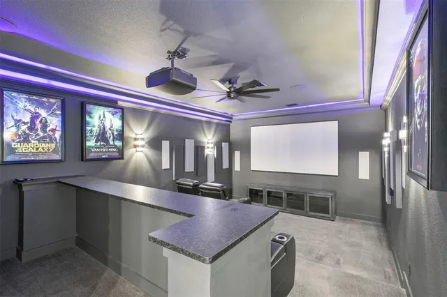 a kitchen with stainless steel appliances granite countertop a sink a stove and a wooden cabinets