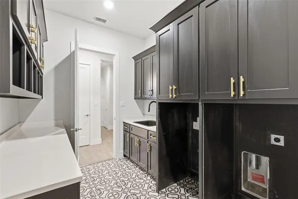 a kitchen with stainless steel appliances granite countertop a refrigerator a sink and dishwasher