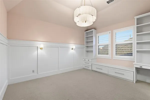 an empty room with chandelier