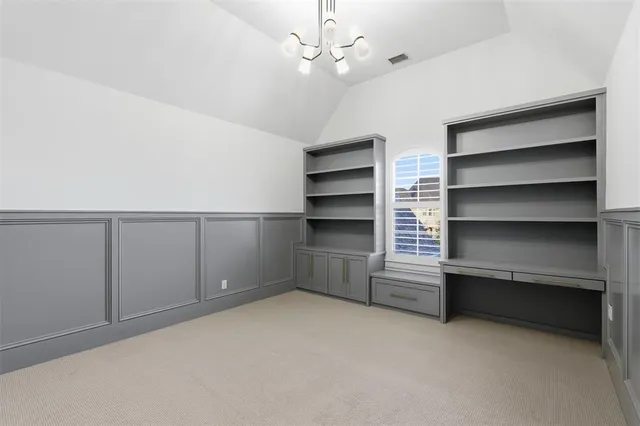 a view of an empty room with a white walls