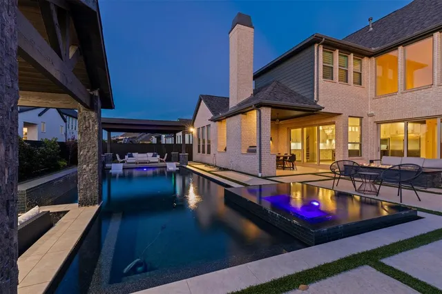 a view of a swimming pool with a patio
