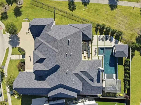 an aerial view of houses with outdoor space