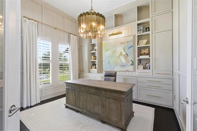 a room with window and chandelier