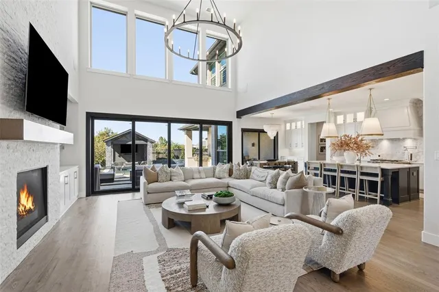a living room with furniture fireplace and flat screen tv