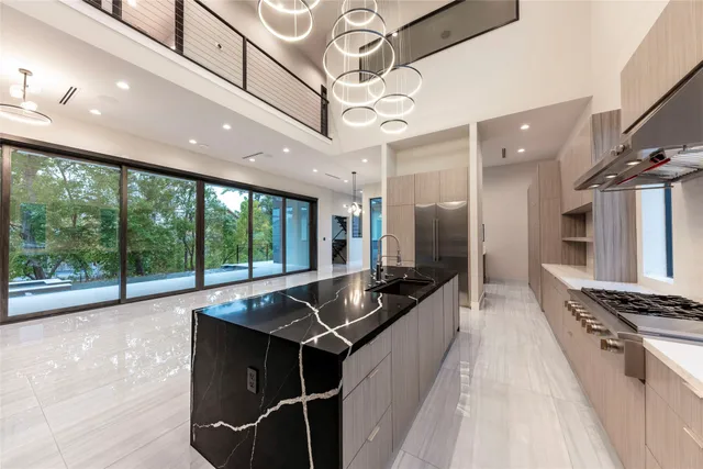 a bathroom with a sink a mirror a bathtub and shower