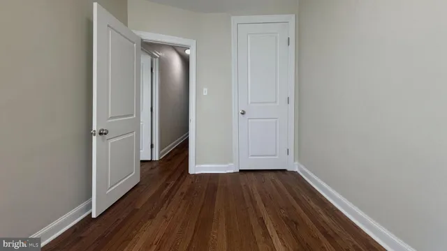 a view of hallway with wooden floor