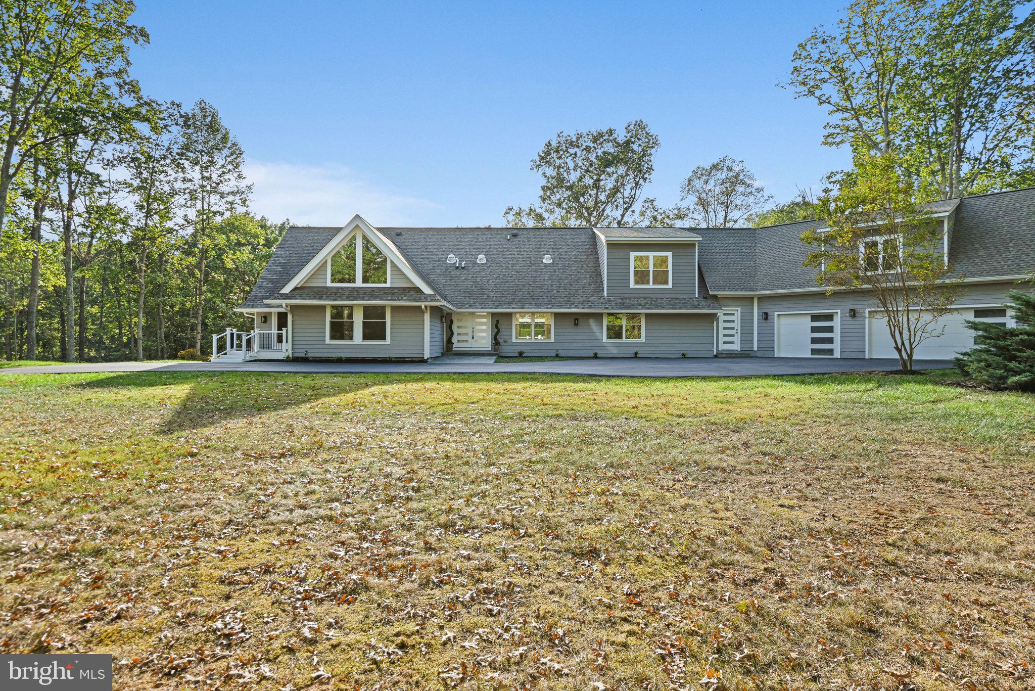 10900 Hunter Station Road Vienna, VA 22181 - Photo 105 of 110 a view of a house with a yard