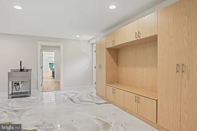 a bathroom with a granite countertop sink a toilet and shower