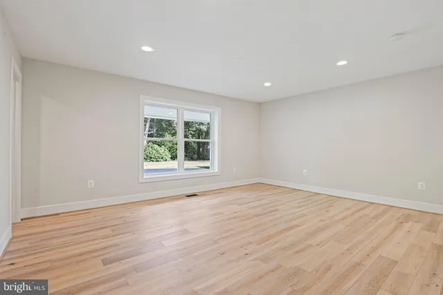 a view of a livingroom with a sink and bench