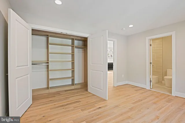 a white bath tub sitting next to a toilet