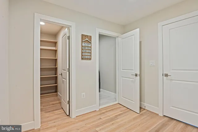a kitchen with white cabinets and a sink