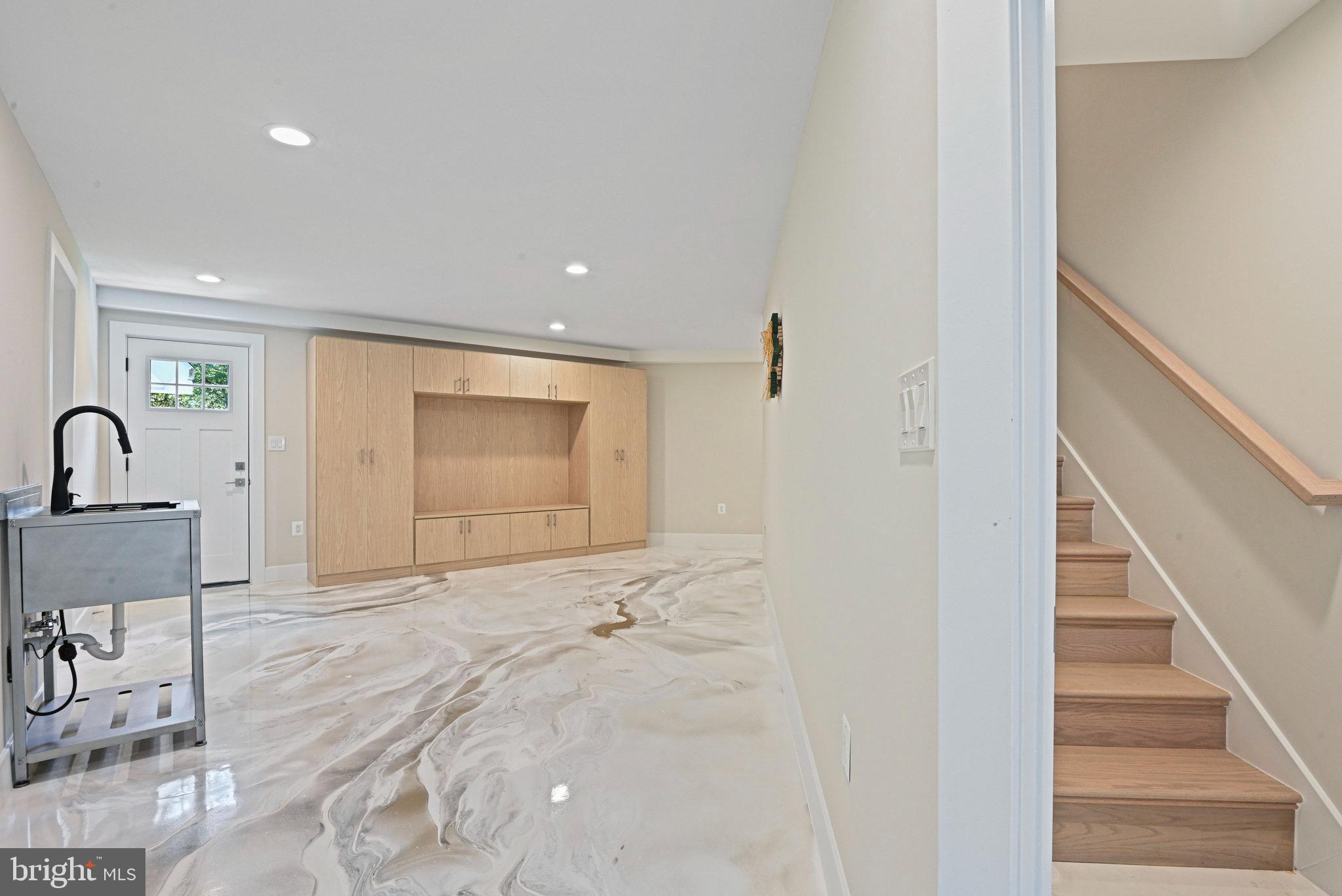 10900 Hunter Station Road Vienna, VA 22181 - Photo 42 of 110 a view of a livingroom with a sink and bench