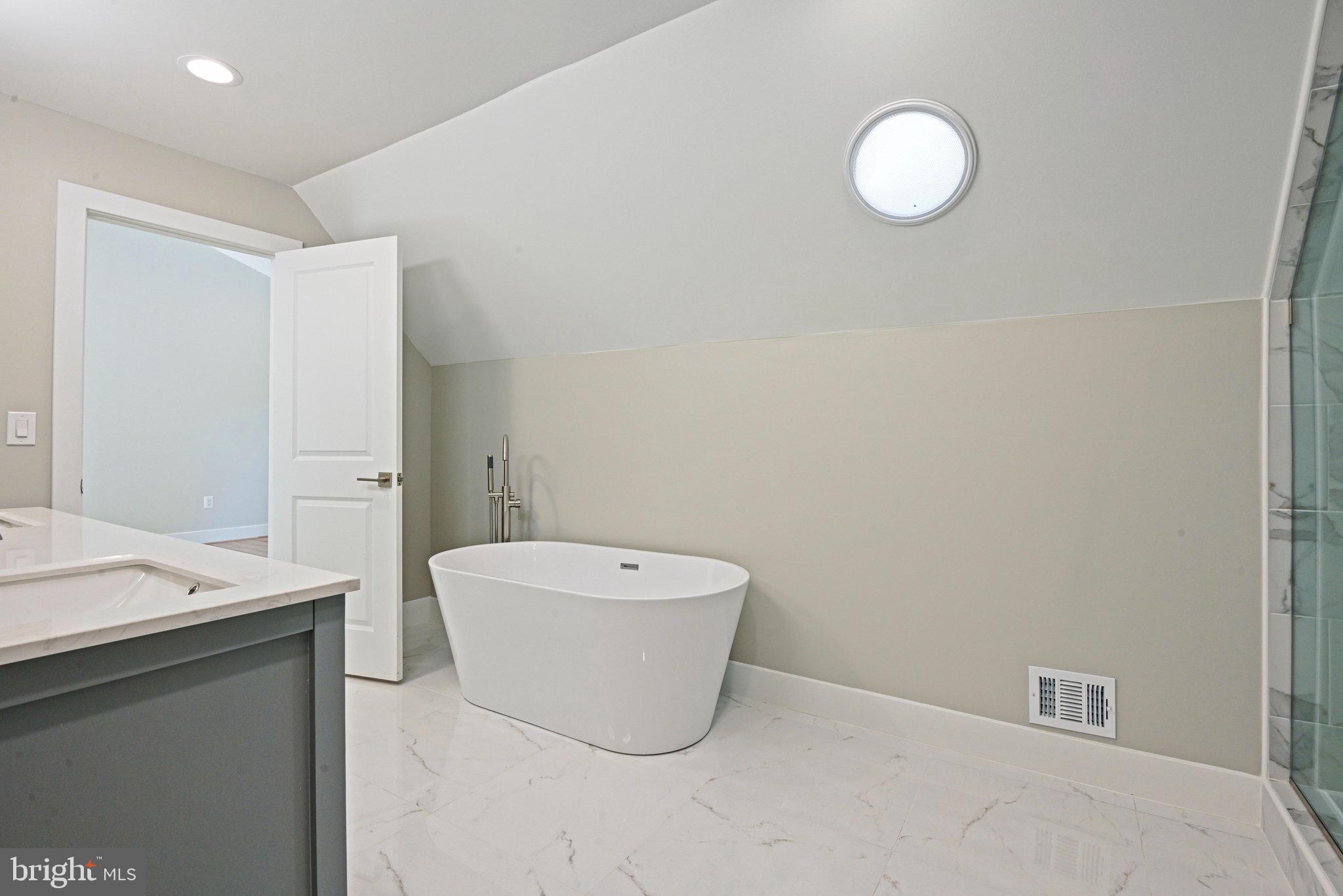 10900 Hunter Station Road Vienna, VA 22181 - Photo 63 of 110 a bathroom with a toilet sink and mirror