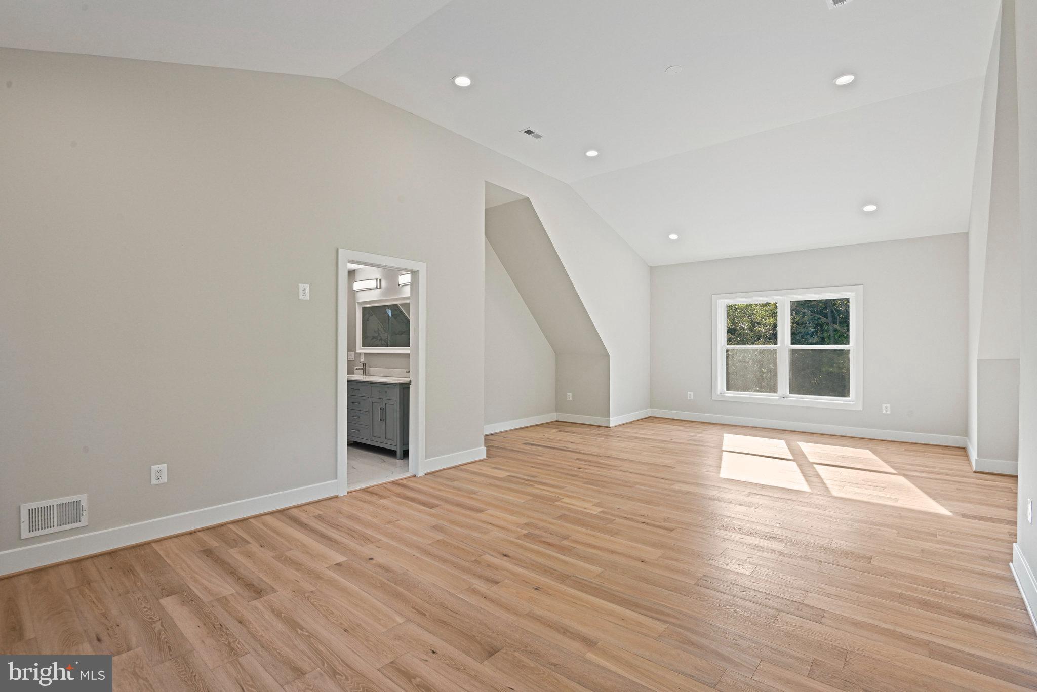 10900 Hunter Station Road Vienna, VA 22181 - Photo 67 of 110 a view of empty room with wooden floor and windows