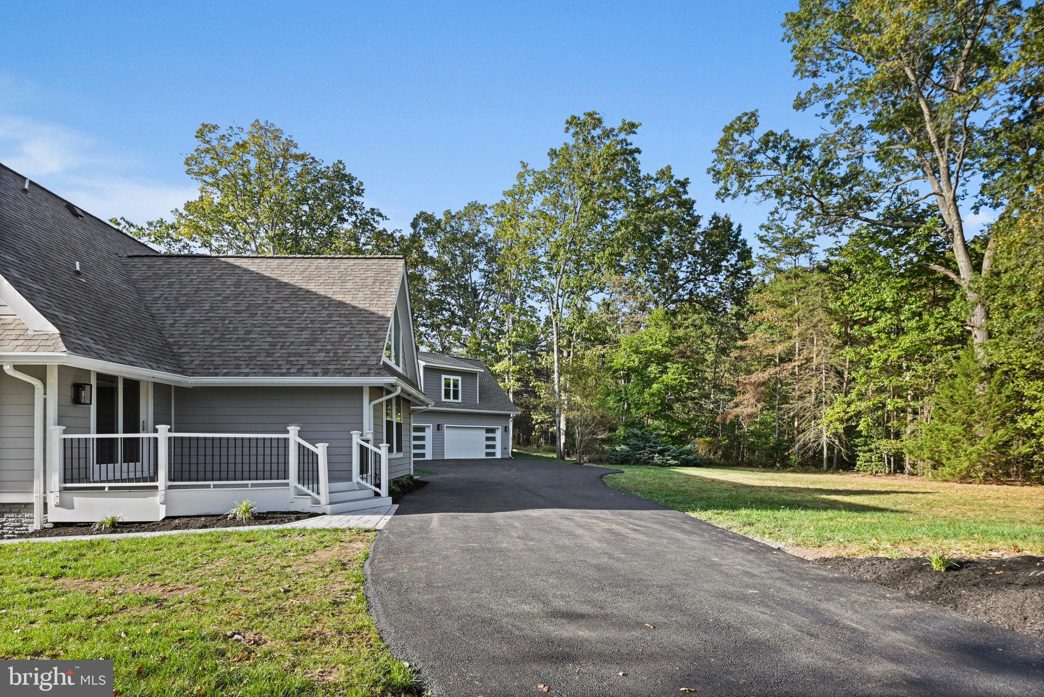 10900 Hunter Station Road Vienna, VA 22181 - Photo 92 of 110 a front view of a house with a yard