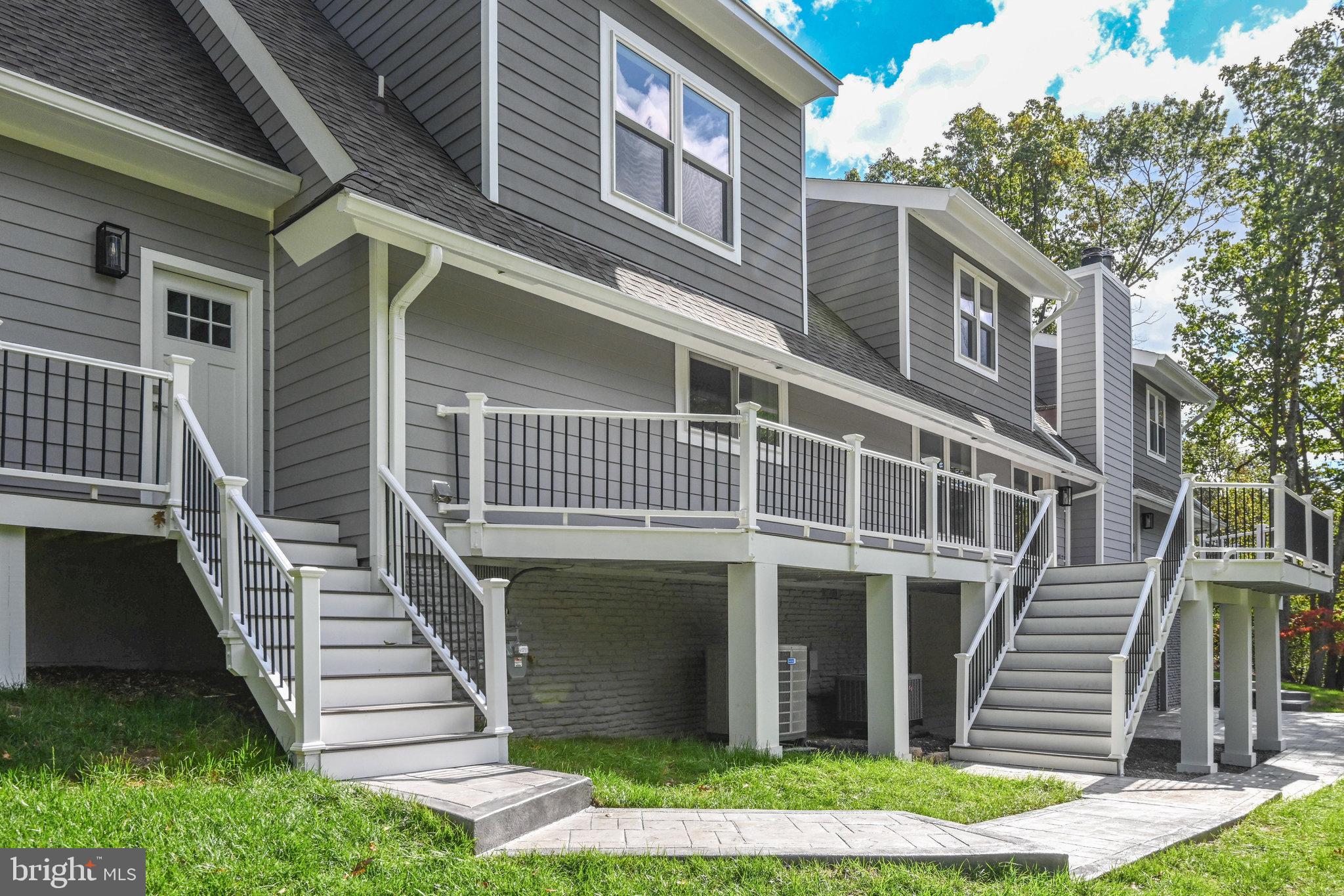 10900 Hunter Station Road Vienna, VA 22181 - Photo 96 of 110 a front view of a house with a garden