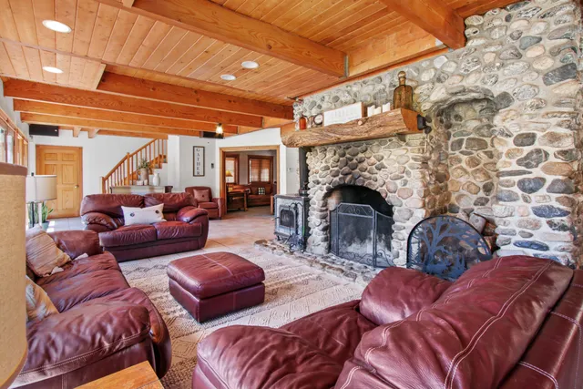 a kitchen with stainless steel appliances granite countertop a stove and a refrigerator