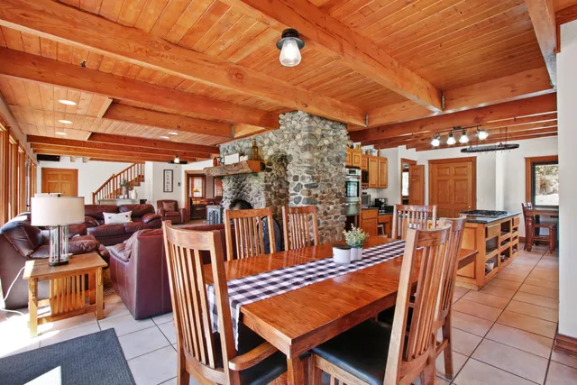 a bedroom with bed and a large window