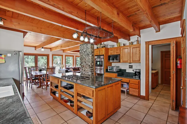 a bedroom with a bed and a flat tv screen in it