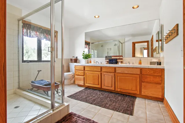 a view of a house with a yard covered in snow