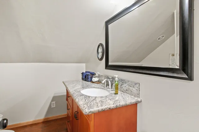 a bath tub sitting in a bathroom next to a window