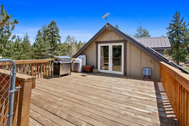 a living room with furniture a fireplace and a table