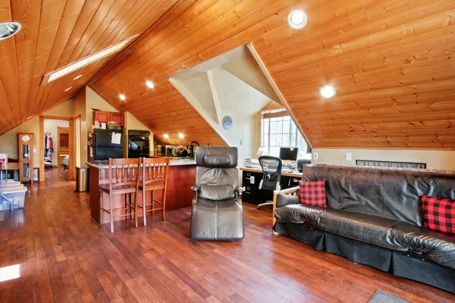 a kitchen with stainless steel appliances kitchen island granite countertop a sink and cabinets