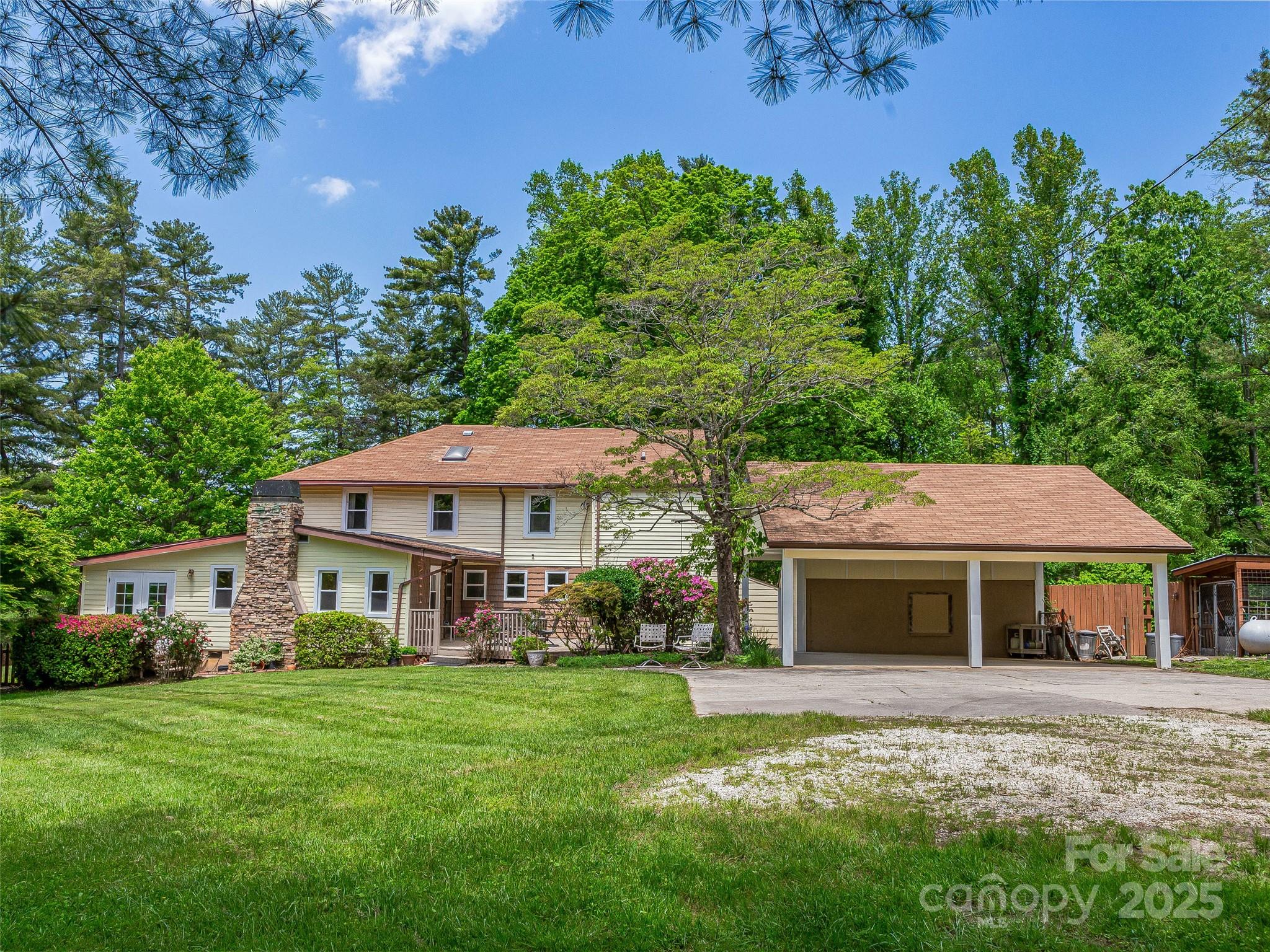 98 Ducker Road Arden, NC 28704 - Photo 3 of 48 a front view of a house with garden