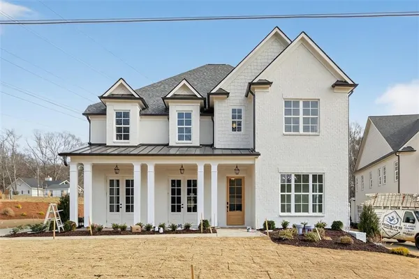 a front view of a house with a yard